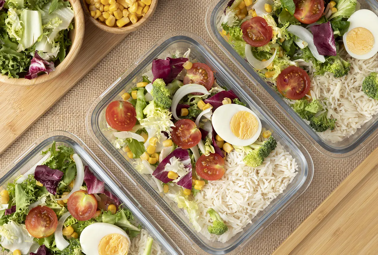 meal prep containers lined up on a countertop