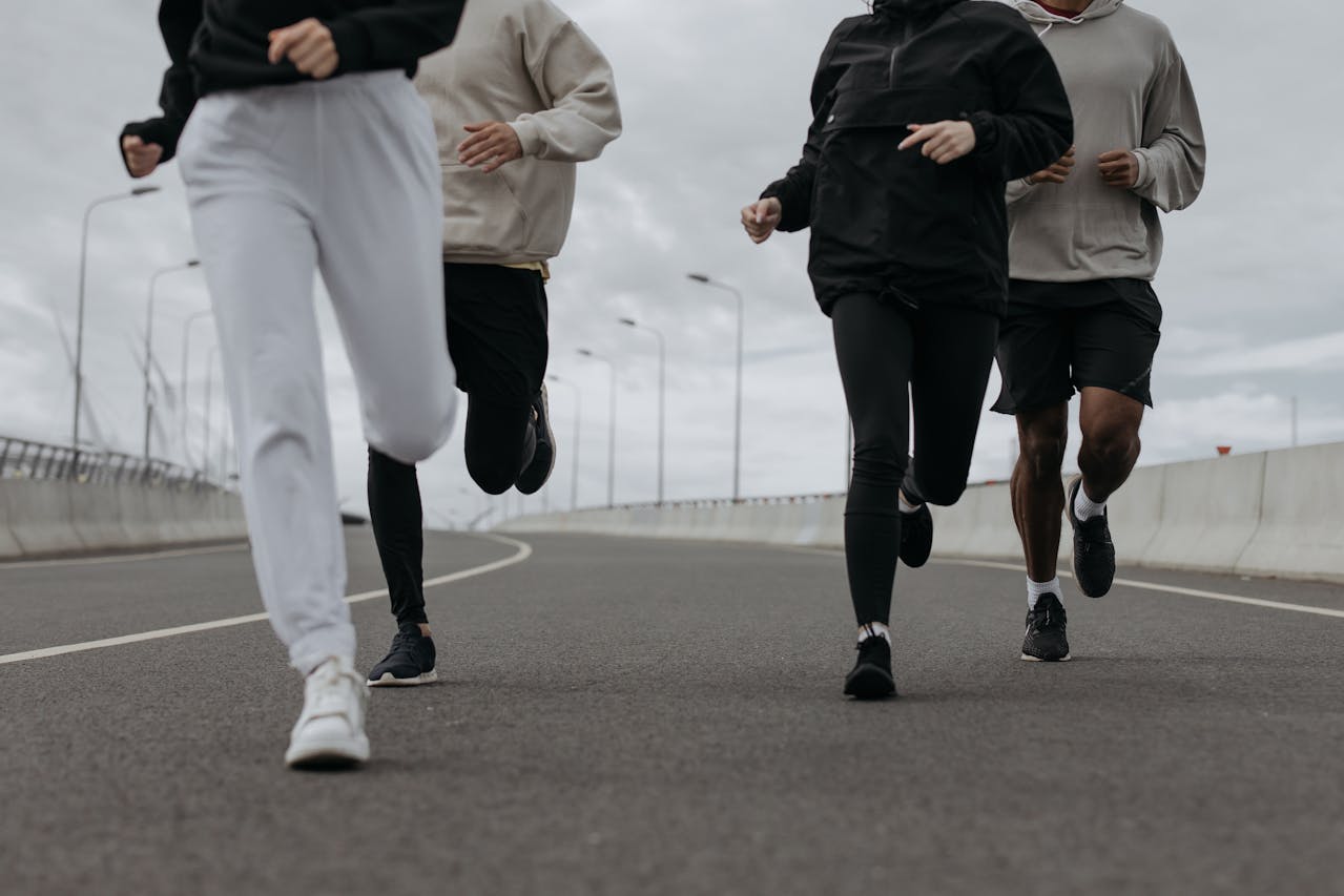 People jogging together outdoors to boost energy naturally after 40
